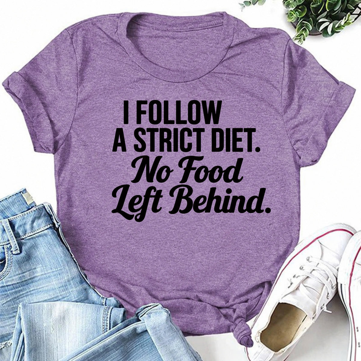 Purple women's T-shirt with I Follow A Strict Diet. No Food Left Behind graphic