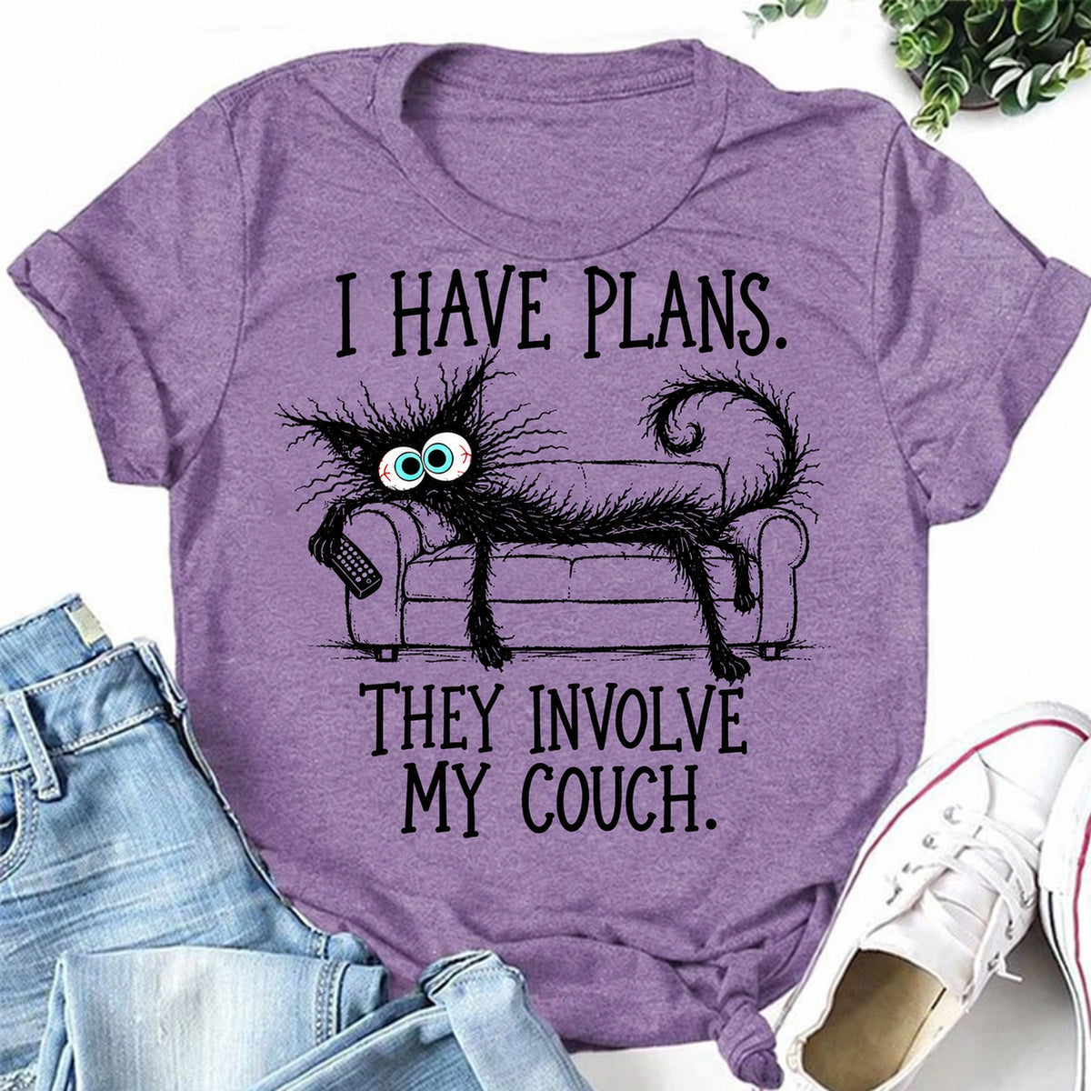 Purple women's T-shirt with I Have Plans. They Involve My Couch graphic