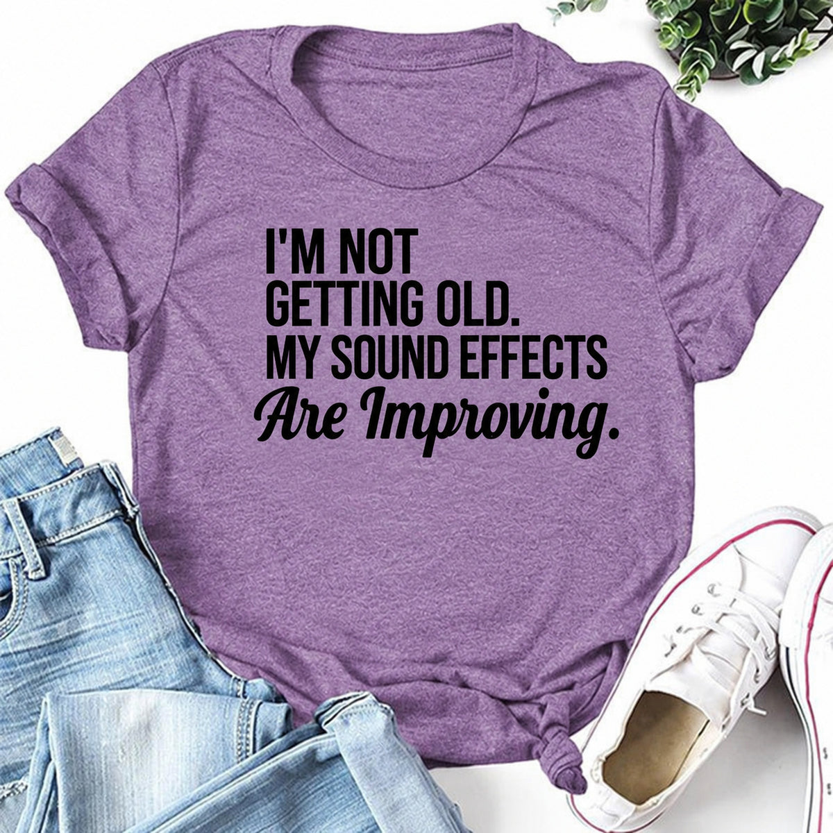 Purple women's T-shirt with I'm Not Getting Old. My Sound Effects Are Improving graphic