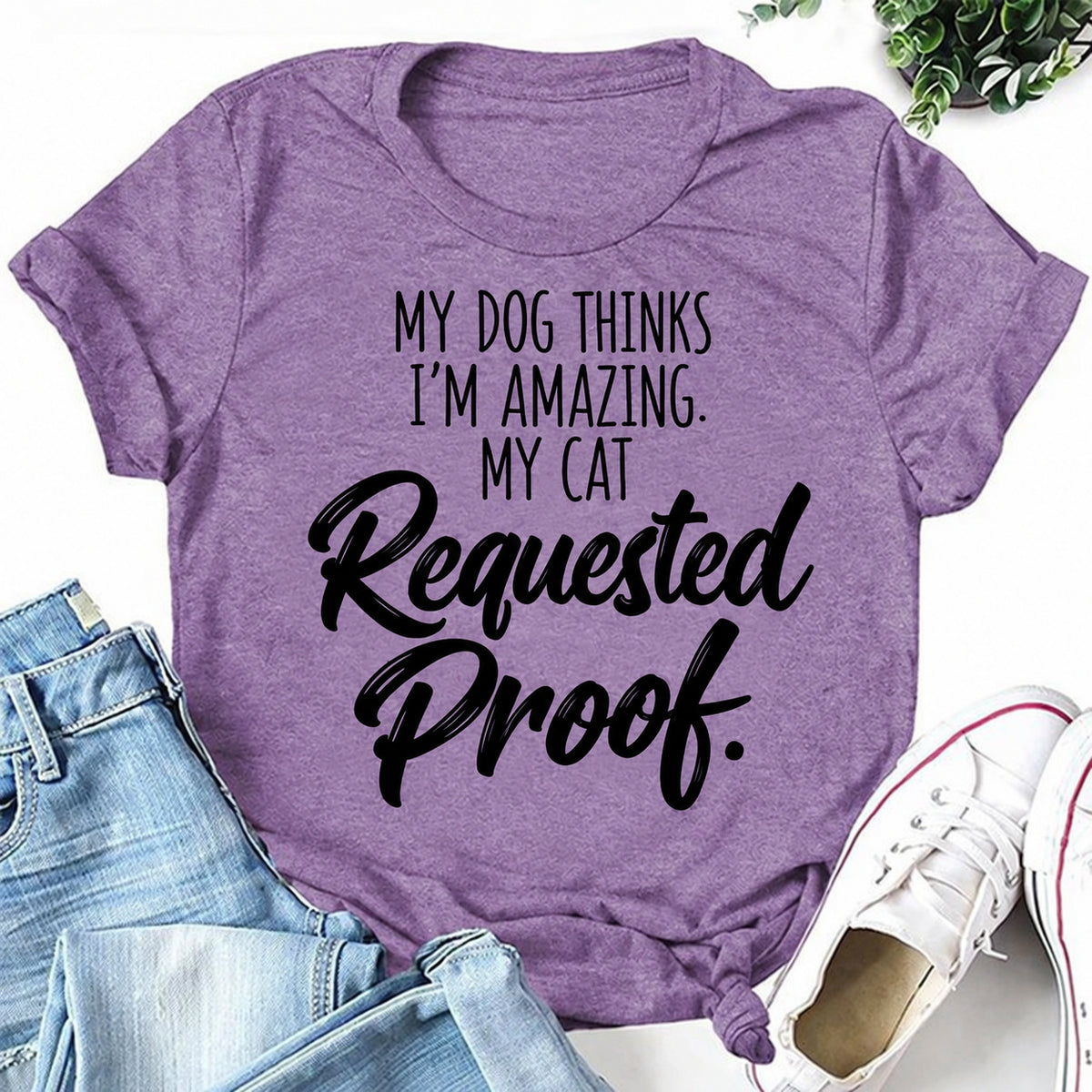 Purple women's T-shirt with My Dog Thinks I'm Amazing. My Cat Requested Proof graphic