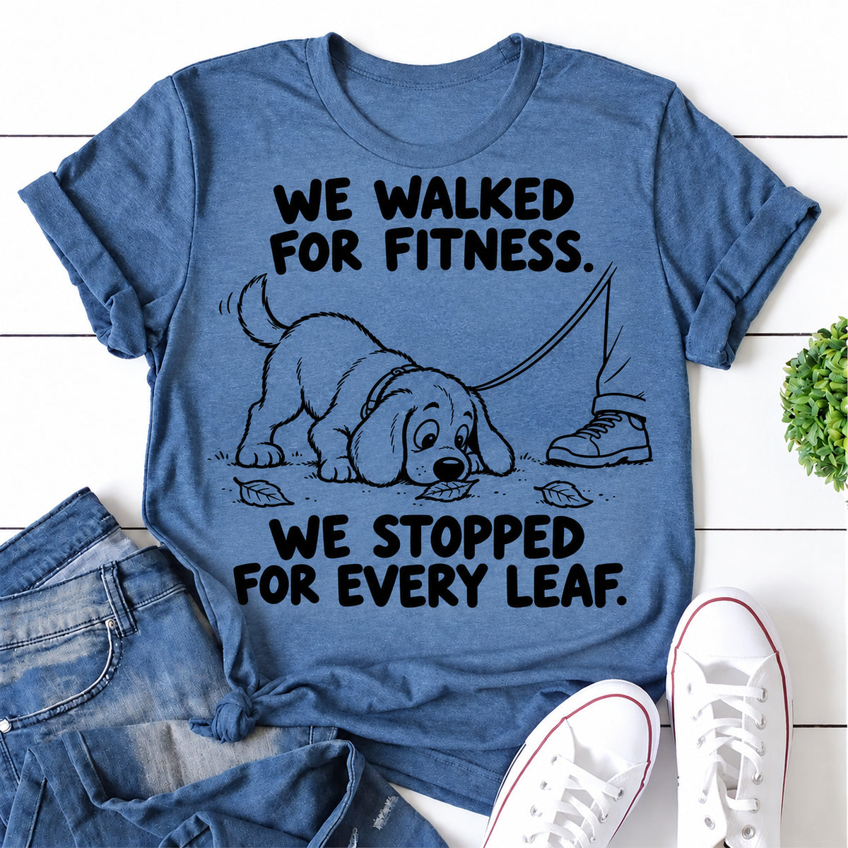 Blue women's T-shirt with We Walked For Fitness. We Stopped For Every Leaf graphic