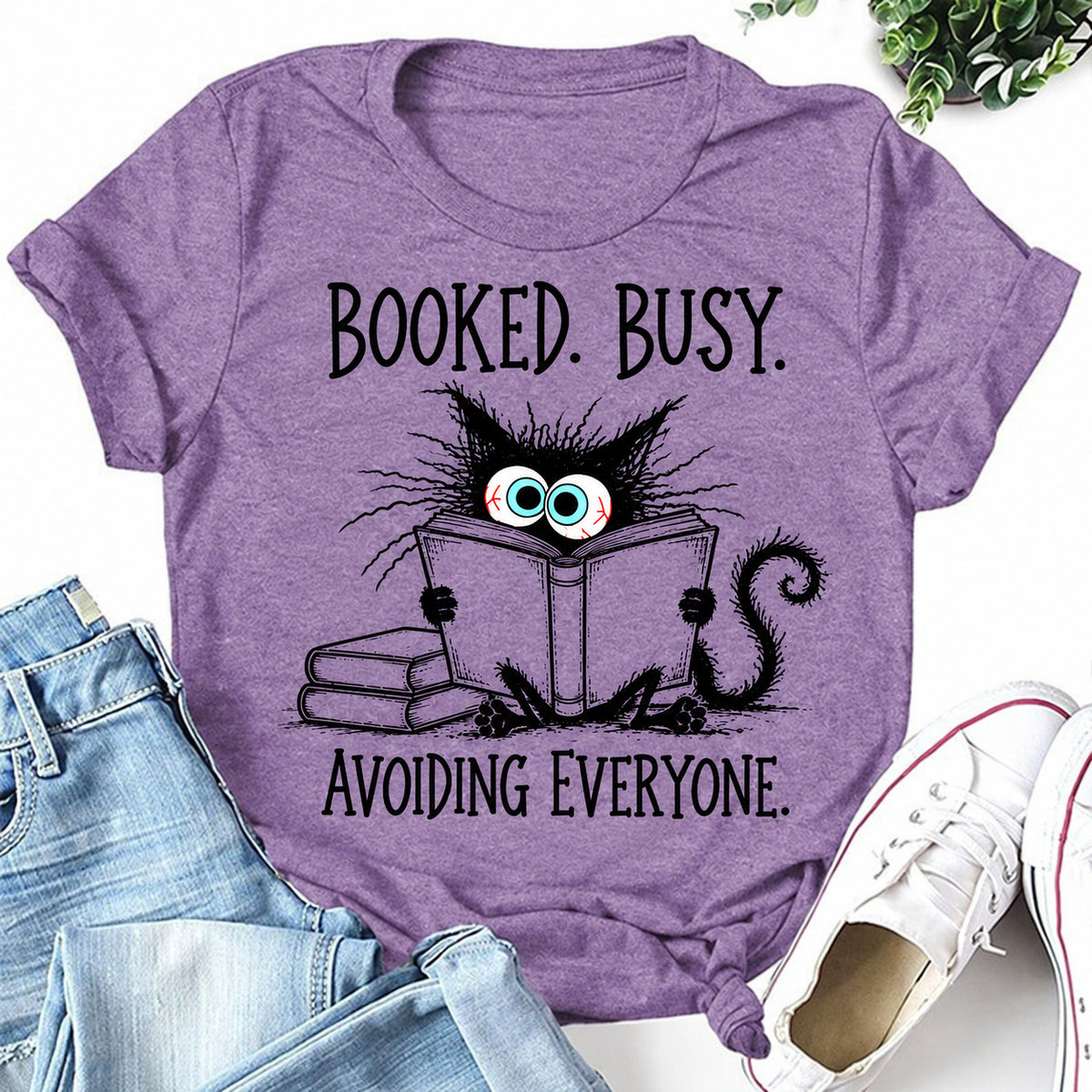 Purple women's T-shirt with Booked. Busy. Avoiding Everyone graphic