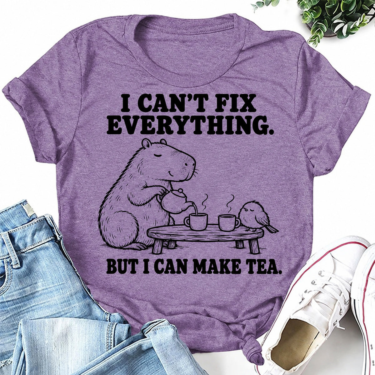 Purple women's T-shirt with I Can't Fix Everything. But I Can Make Tea graphic