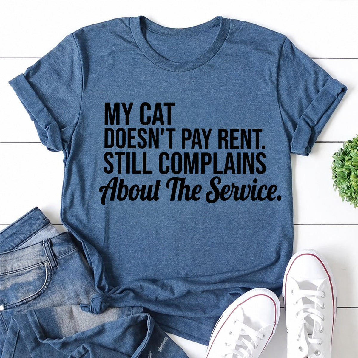Blue women's T-shirt with My Cat Doesn't Pay Rent. Still Complains About The Service graphic