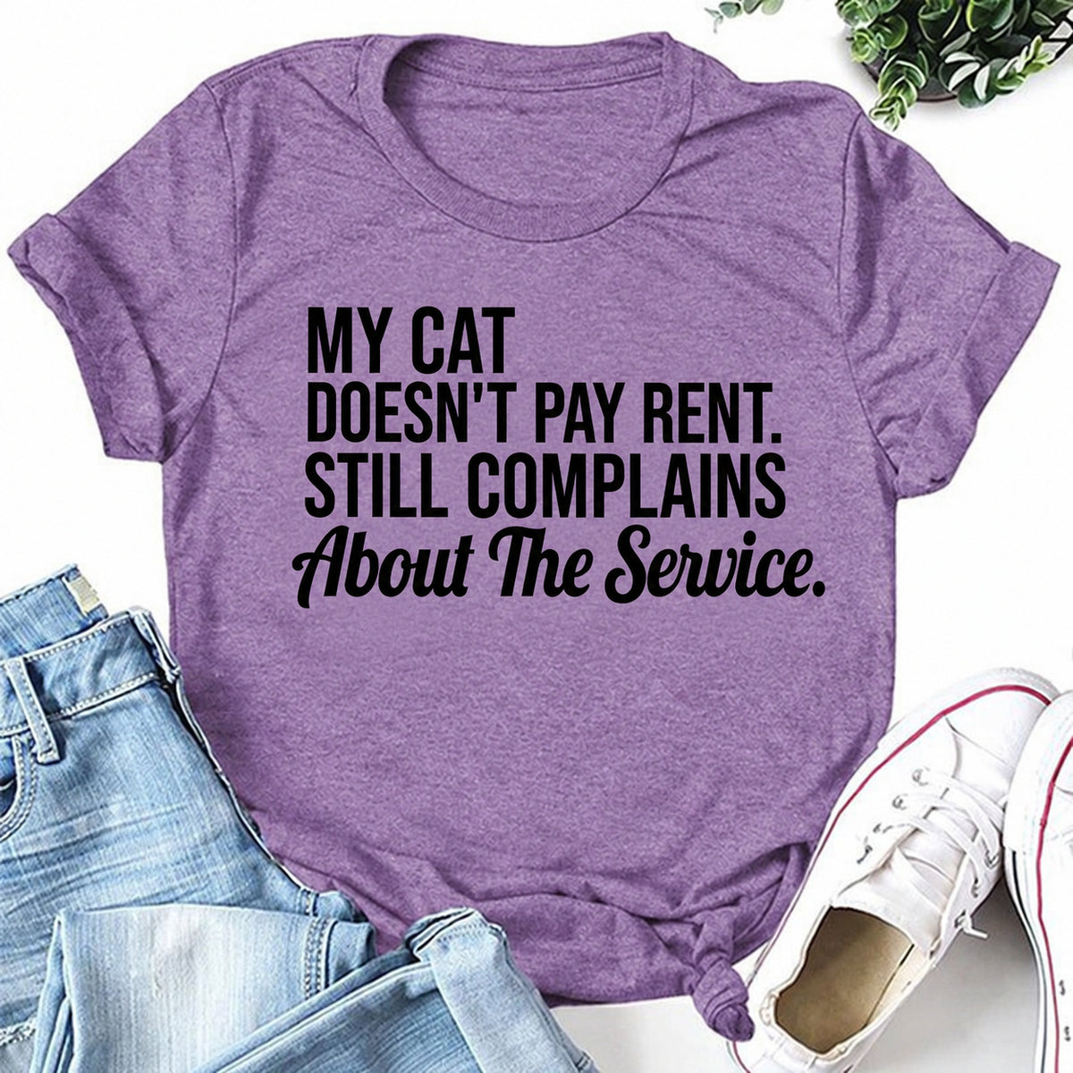 Purple women's T-shirt with My Cat Doesn't Pay Rent. Still Complains About The Service graphic