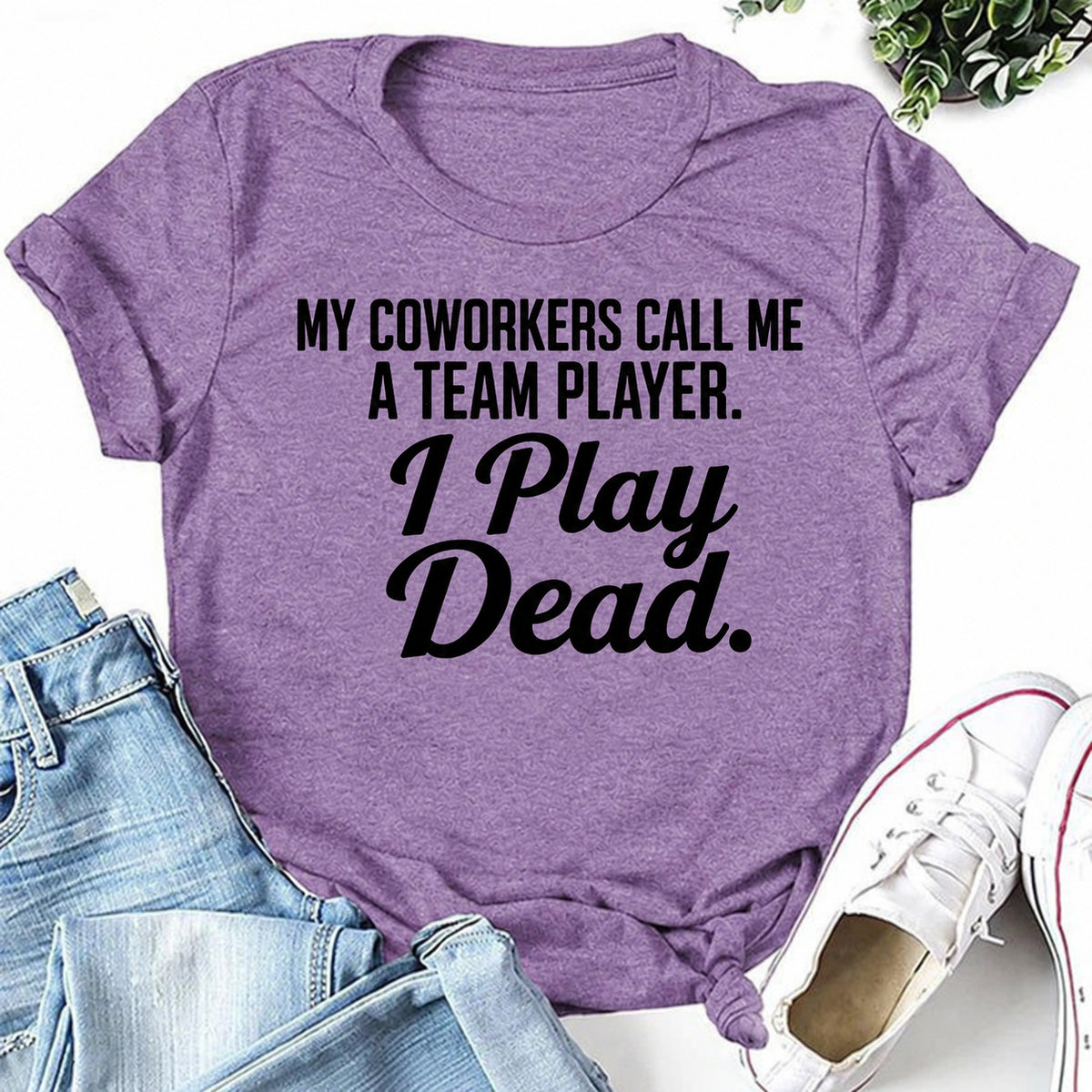 Purple women's T-shirt with My Coworkers Call Me A Team Player. I Play Dead graphic