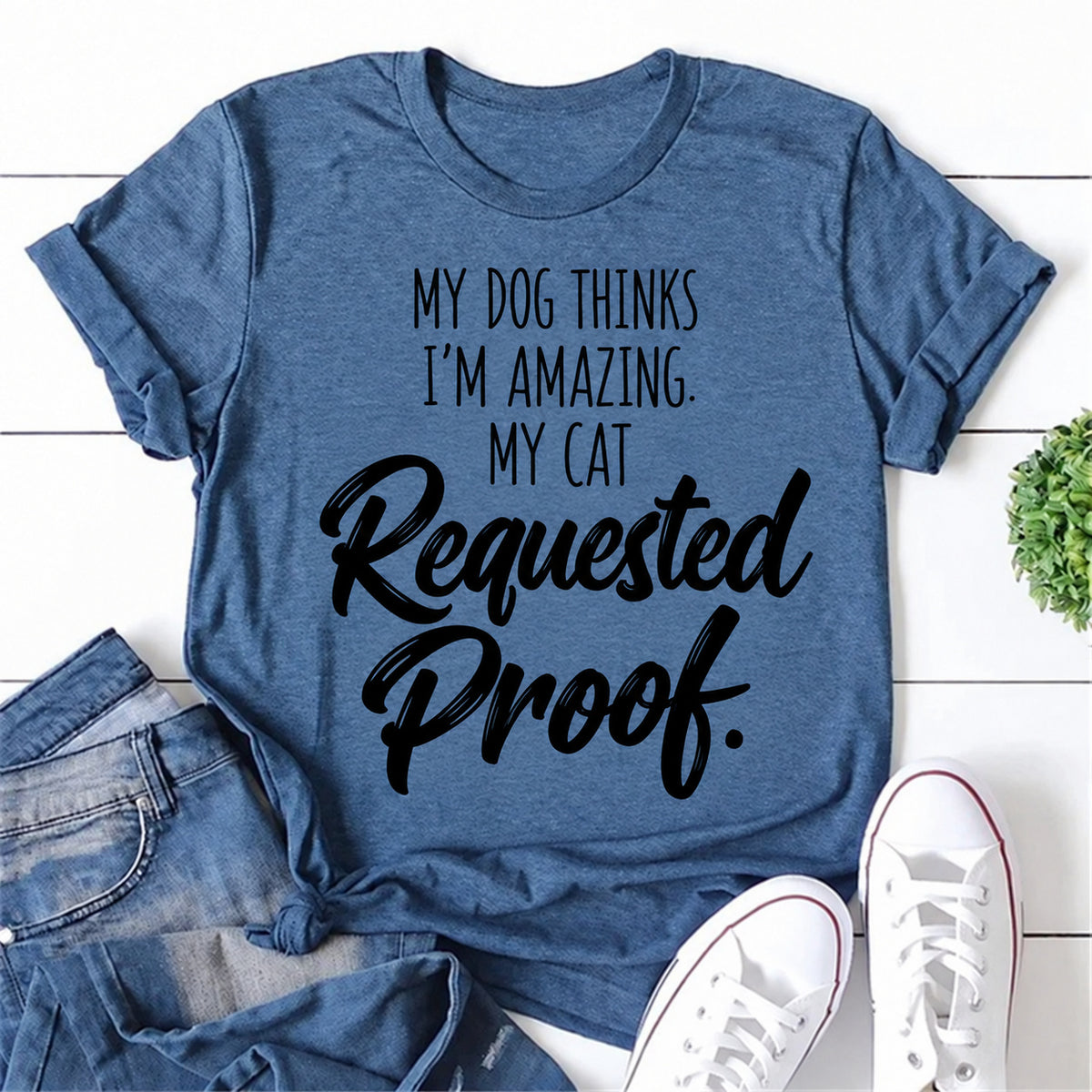 Blue women's T-shirt with My Dog Thinks I'm Amazing. My Cat Requested Proof graphic