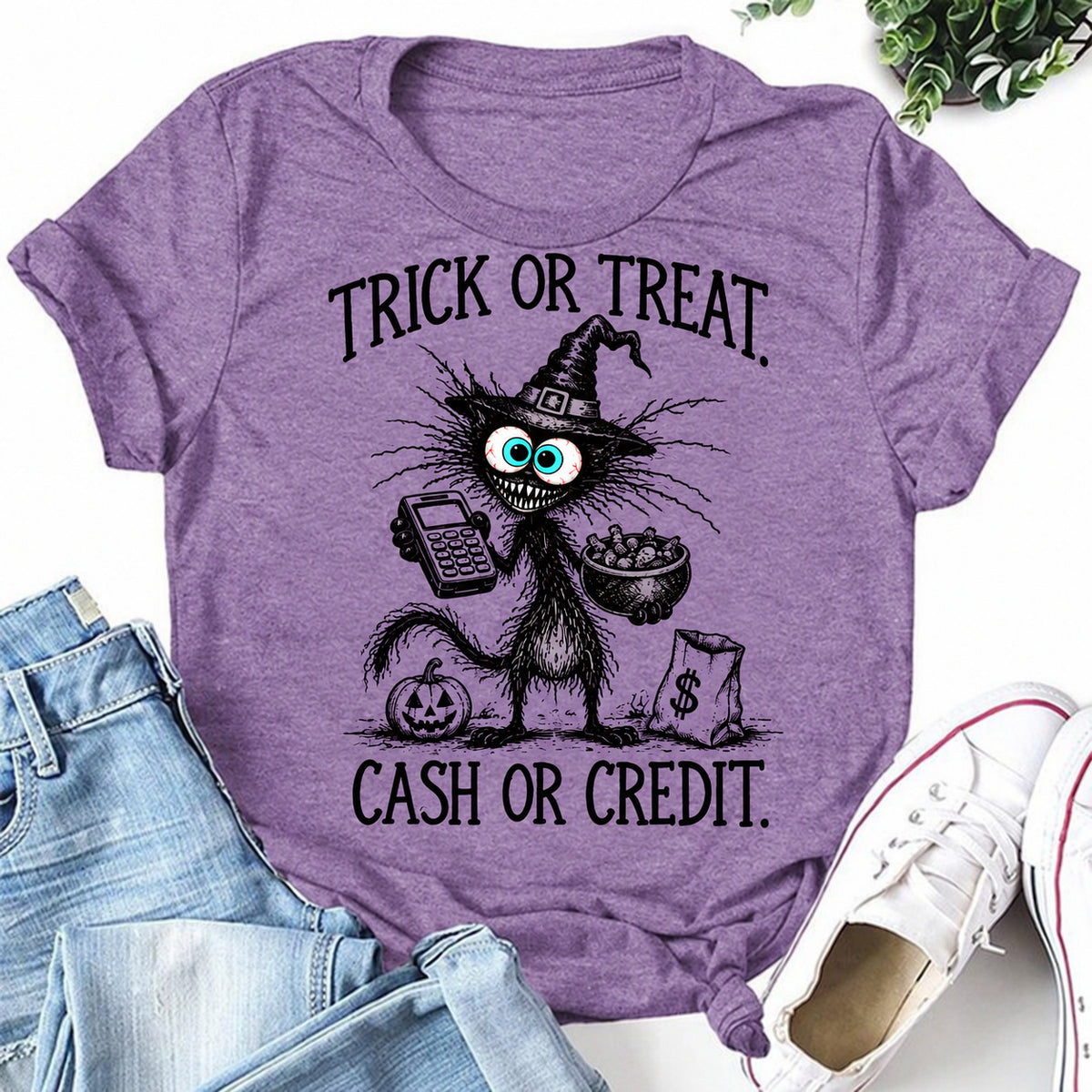 Purple women's T-shirt with Trick Or Treat. Cash Or Credit graphic